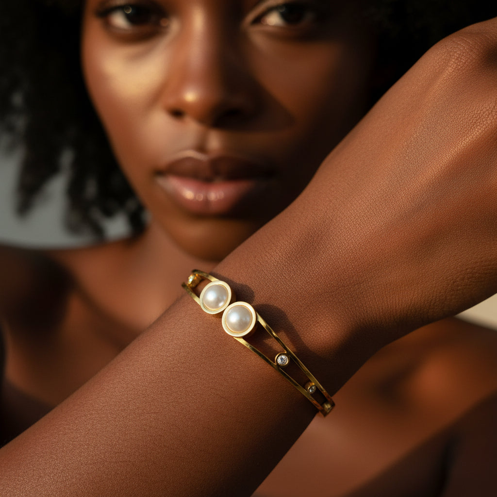 Black female model wearing Graceful Pearl Harmony Bangle highlighting pearl bracelet styling