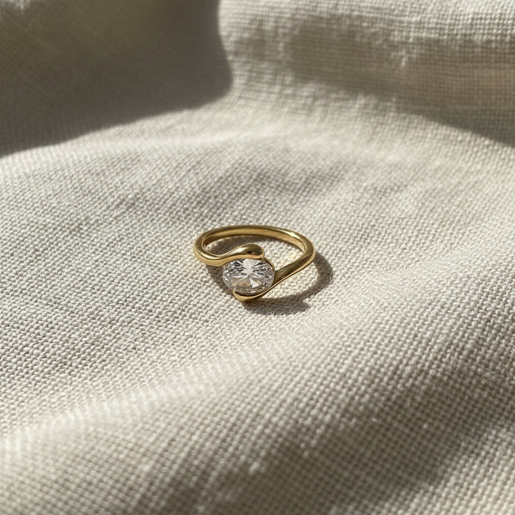 Luna Wrap Ring worn on finger – modern gold ring for women