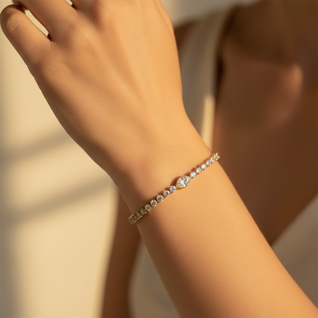 A model's wrist wearing the Celestia Tennis Bracelet to showcase its radiant glow and fluid, comfortable fit.