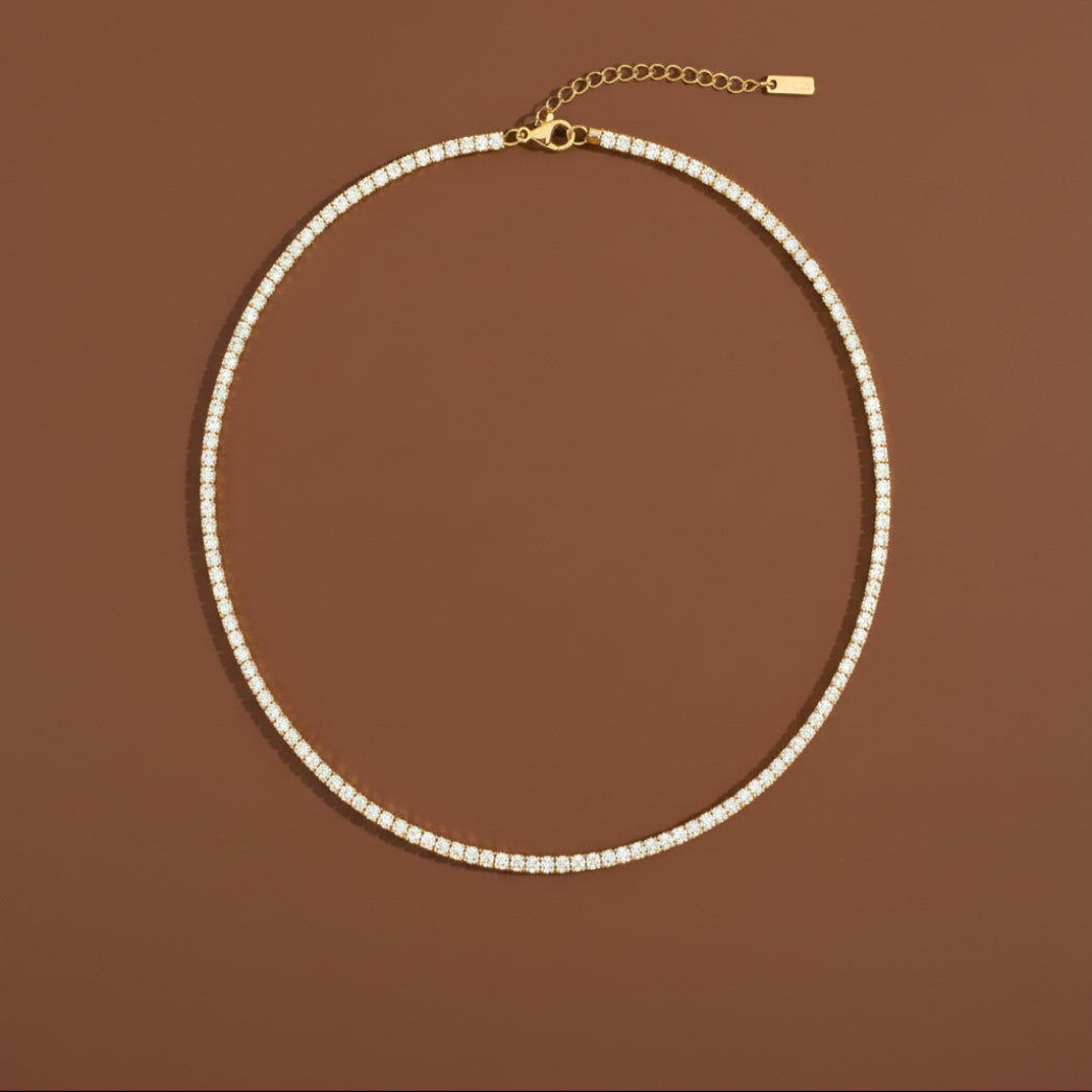 A model wearing the Premium Tennis Chain Necklace to show the adjustable fit and brilliant shine on the neckline.