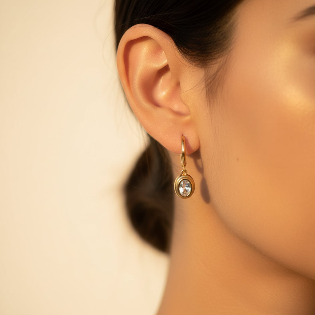 Premium, minimal couture-inspired jewelry packaging box alongside the gold crystal drop earrings.