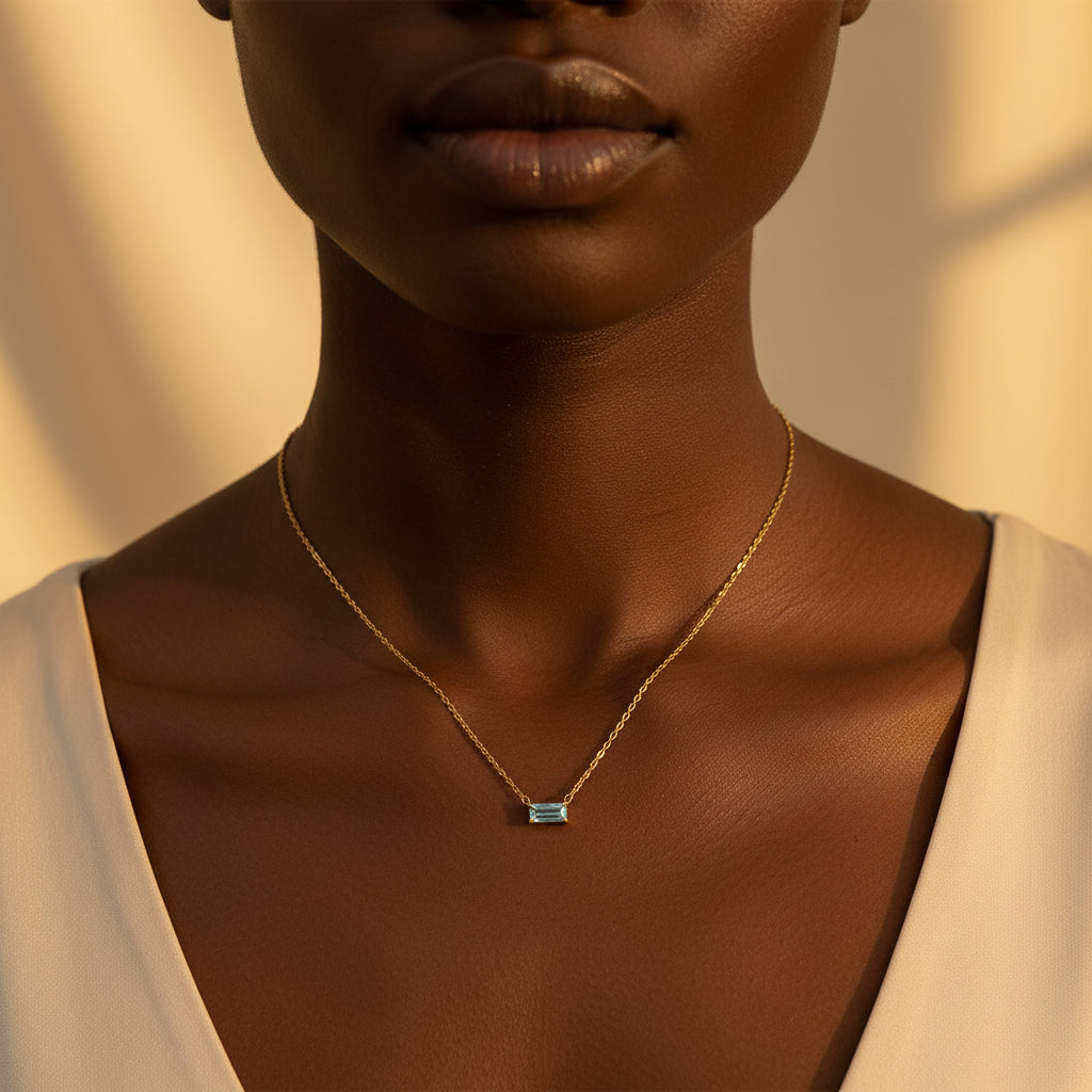 Black female model wearing the Serene Sky Necklace highlighting elegant everyday styling.