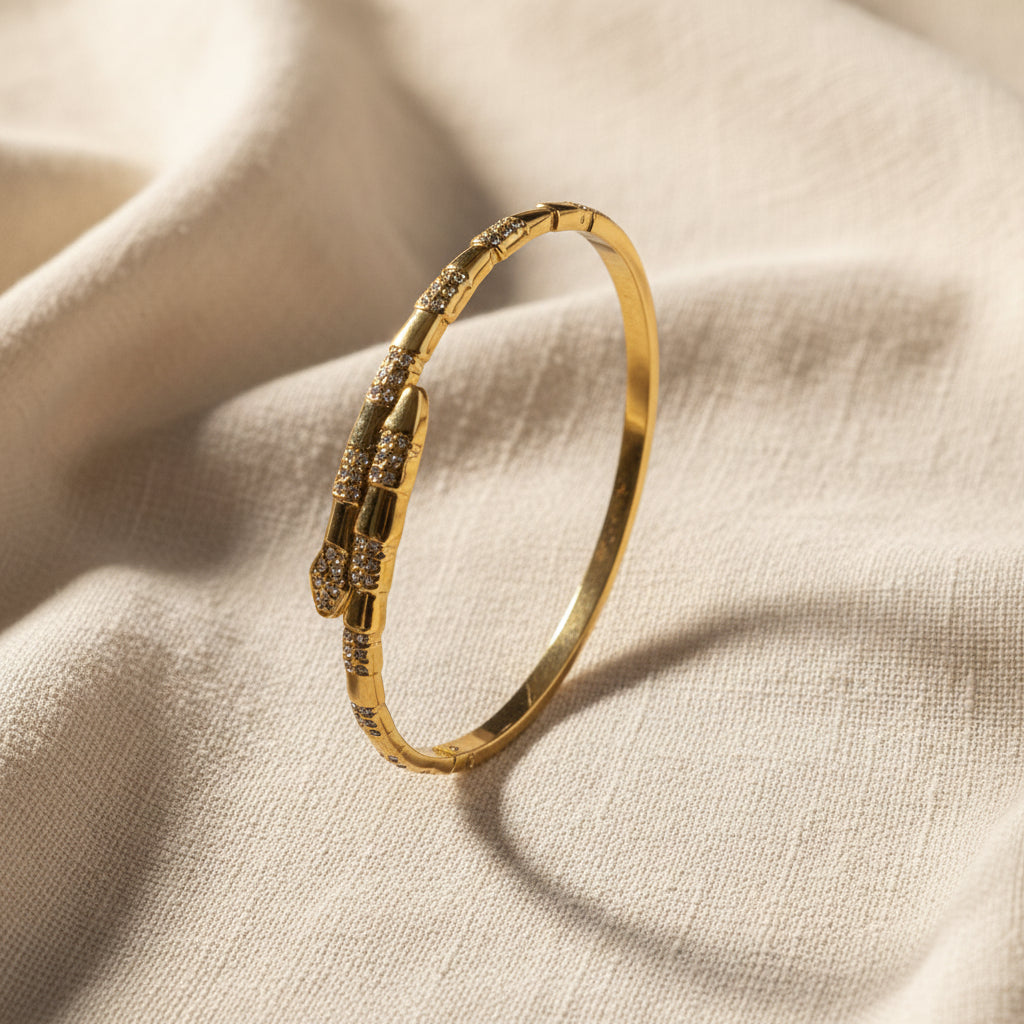Gold bracelet on a textured surface