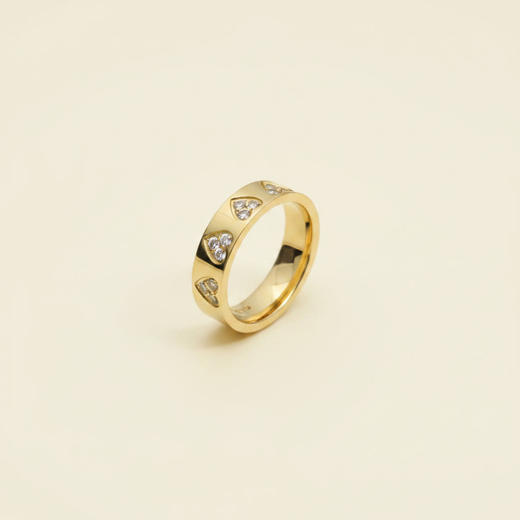 Sparkling Heart Band Ring close-up of heart-cut cubic zirconia stones in gold plated band setting