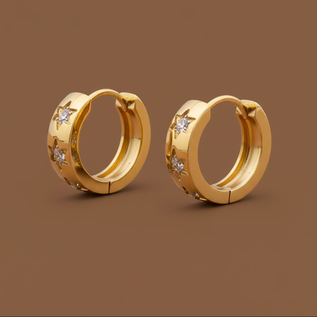 A high-quality front view of the Star Crystal Hoop Earrings featuring shimmering star charms and a gold-plated finish.
