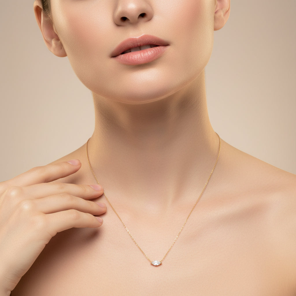 A professional flat-lay catalogue image showing the 18K gold starburst charm necklace arranged in a precise circle with soft shadows on a rich cocoa brown background.