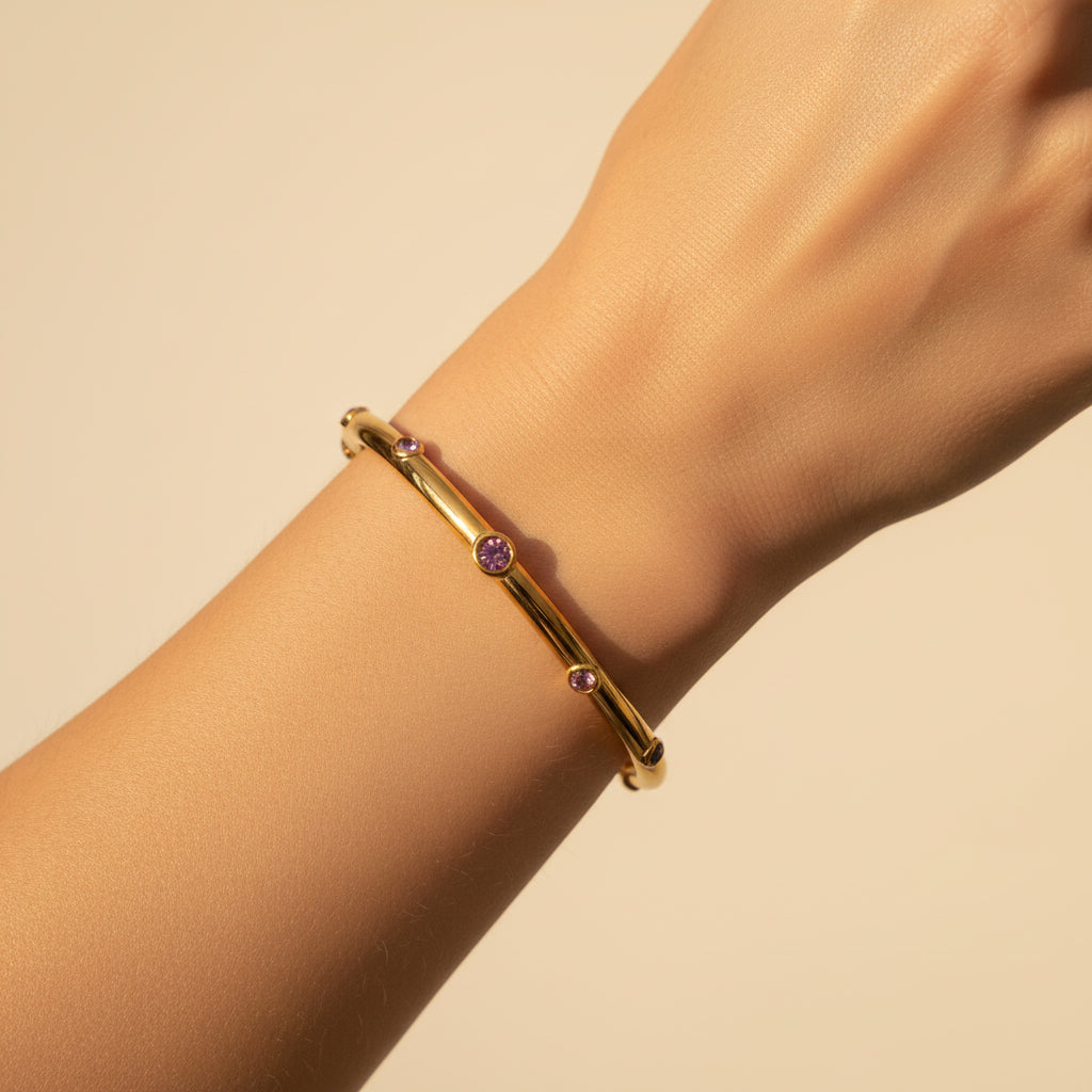 The Pink Stone Gold Bangle presented in premium Swikaar packaging, ideal for a luxury gift for women.