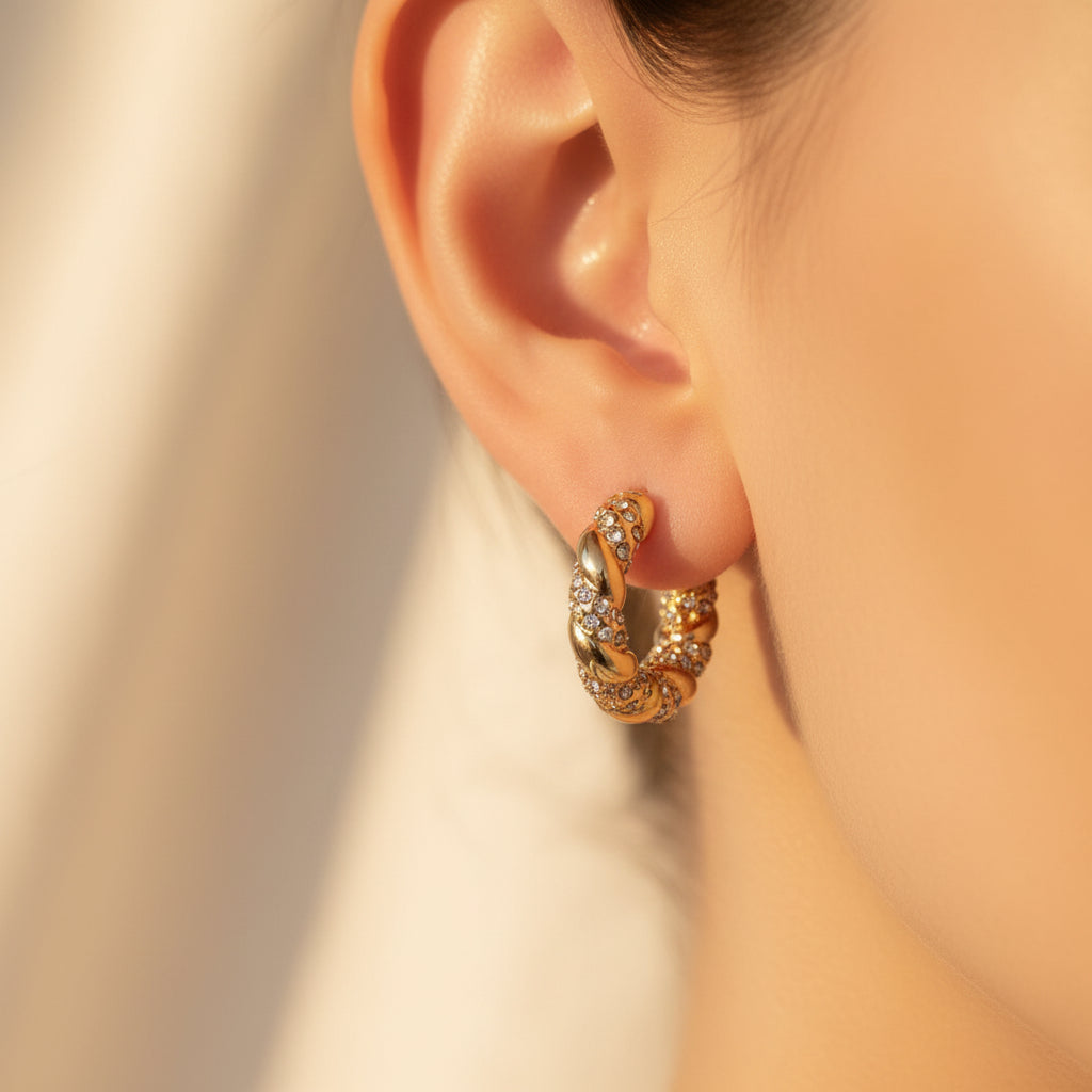 Twisted Crystal Hoop Earrings close-up of cubic zirconia stones encrusted on twisted gold hoop