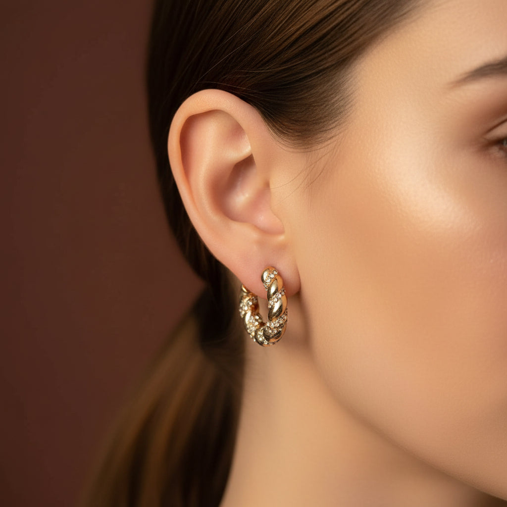 Twisted Crystal Hoop Earrings front view showing twisted gold hoop with encrusted crystal stones